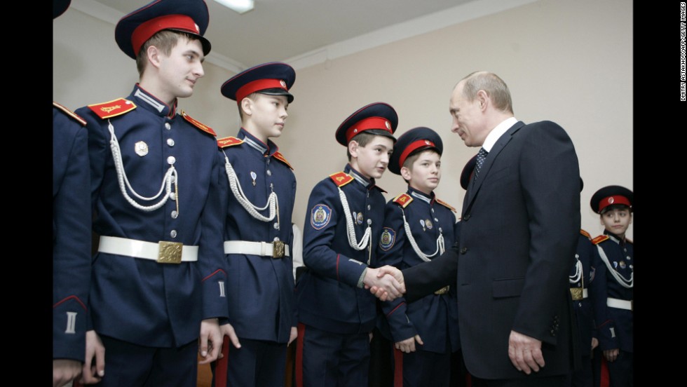 Russian President Vladimir Putin visits a Cossack cadet academy in Rostov-on-Don in February 2008.  Analysts have expressed concern that Moscow&#39;s new cozy relationship with the Cossacks could backfire, as some Cossacks have demanded more power and land rights.