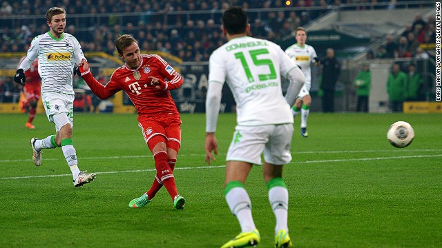 Mario Gotze sweeps home Bayern Munich&#39;s first goal against Monchengladbach as the Budesliga resumed on Friday night. 