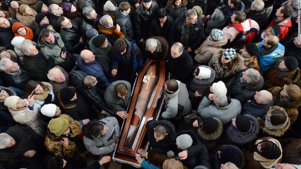 Some 10,000 Ukrainians take part in the funeral ceremony of dead protester Yuri Verbytsky in the western city of Lviv on Friday, January 24.