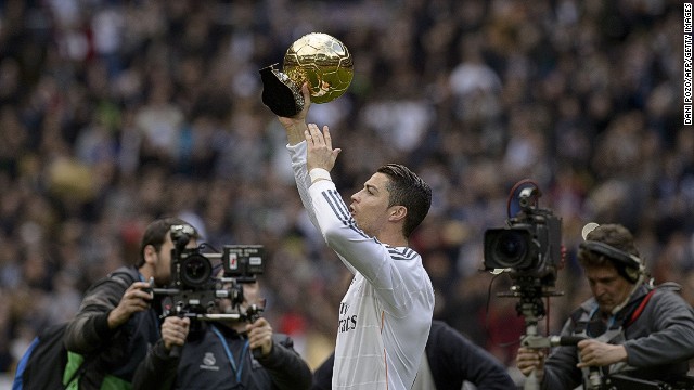 Cristiano Ronaldo shows the FIFA&#39;s Ballon d&#39;Or to fans at the Bernabeu before the match against Granada on Saturday.