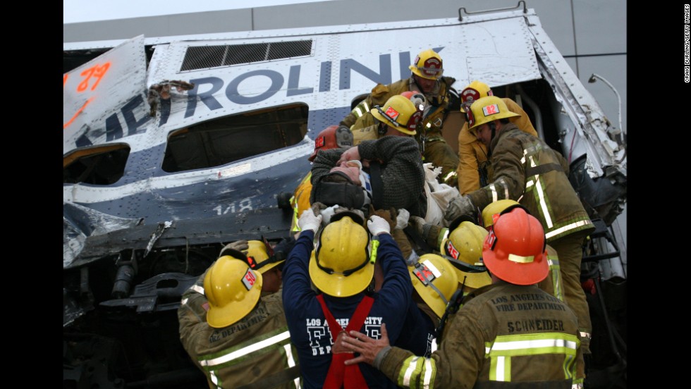 Rescue workers from Los Angeles tend to victims of an early morning Metrolink commuter train collision in Glendale, California, on January 26, 2005. Eleven people died and more than 180 were injured in the derailment, caused when Juan Manuel Alvarez parked his car on the tracks. Alvarez was convicted of murder and sentenced to 11 consecutive life terms in prison.