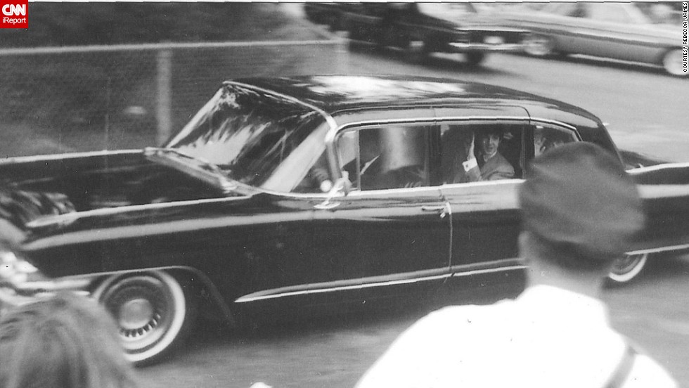 James snapped this photo of Paul McCartney driving by in August 1964 while visiting her brother in Detroit. &quot;I heard screaming and learned that The Beatles were staying at a nearby hotel,&quot; she said. &quot;I took off and hung around the hotel driveway and was lucky enough to get that photo.&quot; James recalls a girl fainting right in front of her -- a common sight during the height of Beatlemania.