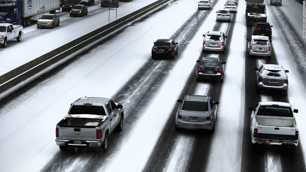 Traffic travels along the highway near downtown Birmingham on January 28.