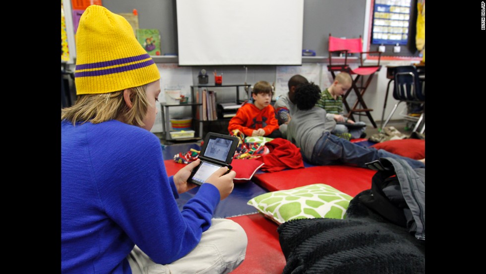 Gavin Chambers plays an electronic game January 29 at Oak Mountain Intermediate School in Indian Springs, Alabama. The &lt;a href=&quot;http://www.cnn.com/2014/01/28/us/winter-weather/index.html&quot;&gt;severe weather forced thousands&lt;/a&gt; of students to spend the night in various school buildings across the state.