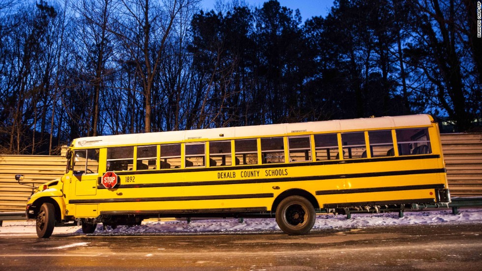 A DeKalb County school bus sits abandoned near Interstate 285 in Dunwoody on January 29.