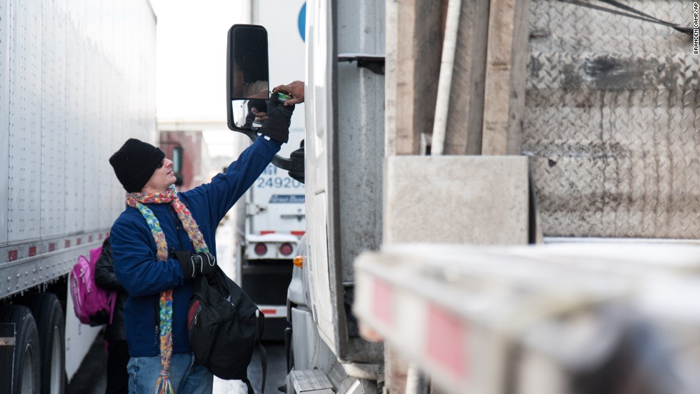 Kevin Moore hands out snacks and water to stranded motorists on Interstate 285 in Dunwoody, Georgia, on January 29.