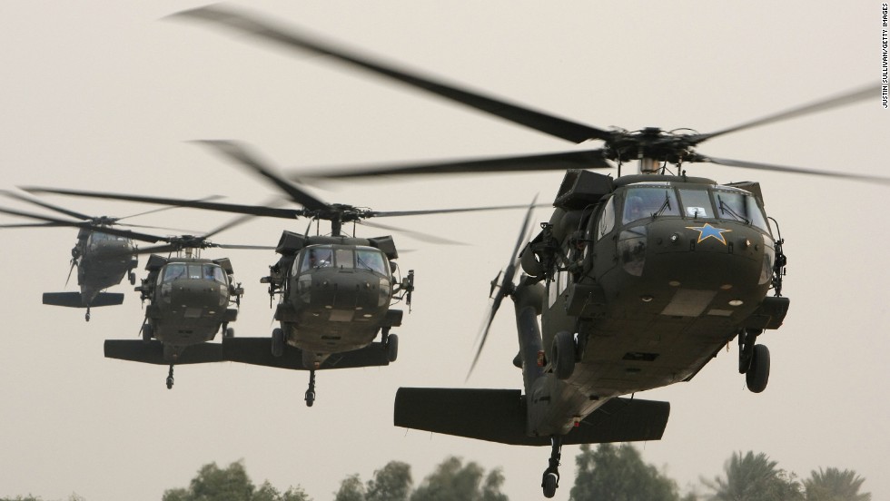 BAGHDAD, IRAQ - DECEMBER 10:  A Blackhawk helicopter (R) carrying U.S. Secretary of Defense Robert Gates arrives in the Green Zone December 10, 2009 in Baghdad, Iraq. Secretary Gates stopped in Iraq following a two day trip to Afghanistan one week after U.S. President Barack Obama announced that he will send an additional 30,000 troops to Afghanistan.  (Photo by Justin Sullivan/Getty Images) *** Local Caption *** Robert Gates