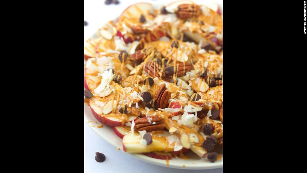 Replace corn chips with apples for apple nachos? Sure! This dessert-like dish mixes apples, nuts and coconut along with peanut butter and chocolate.