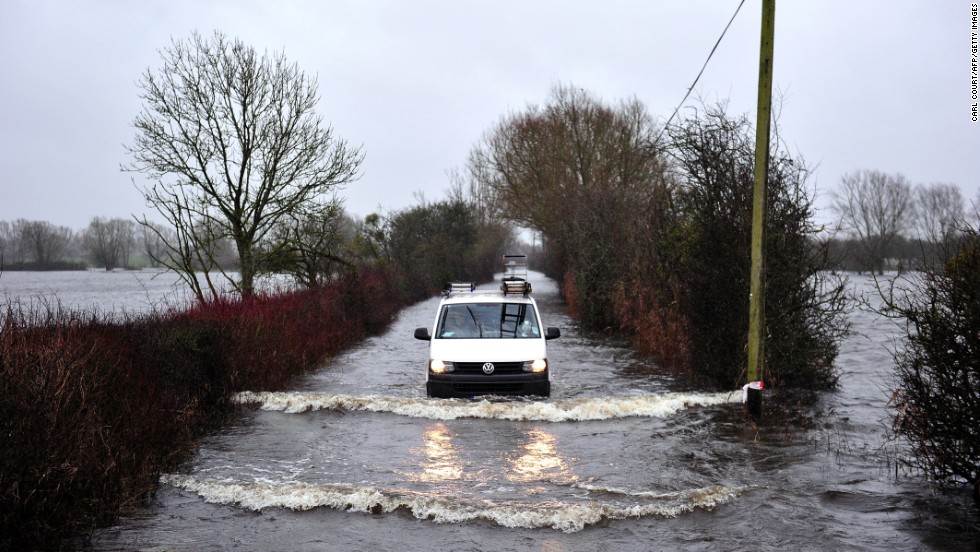 A van drives along a flooded road in Somerset, England, on January 31.