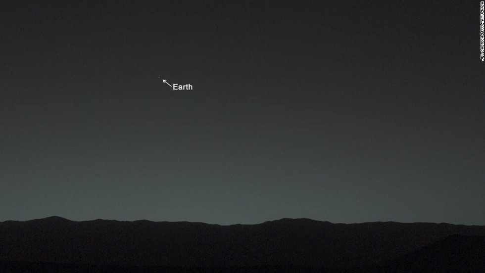 This view of the twilight sky and Martian horizon, taken by Curiosity, includes Earth as the brightest point of light in the night sky. Earth is a little left of center in the image, and our moon is just below Earth. A human observer with normal vision, if standing on Mars, could easily see Earth and the moon as two distinct, bright &quot;evening stars.&quot;