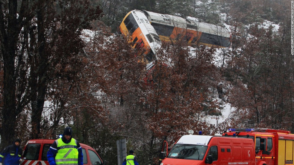 Rescue workers work the scene of a train accident near Digne-les-Bains in the French Alps after a train derailed on February 8. The train collided with a large boulder, leaving two people dead and several others injured.