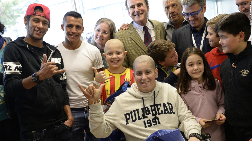 Barcelona is a club that has grown its off-field image to accompany its stunning on-field success, with the Spanish side having been crowned kings of Europe four times. Here, Neymar accompanies Alexis Sanchez during a charity visit to Barcelona&#39;s Hospital del Mar. 