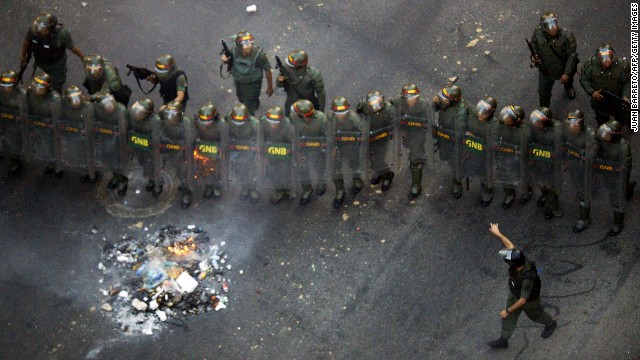 Members of the Venezuelan National Guard take their positions during an opposition demo 