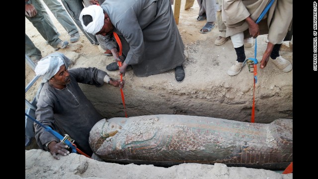 Men dig up the sarcophagus in Luxor. The sarcophagus belonged to a top government official, reports say.