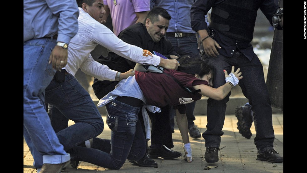 Police detain a student in Caracas on February 12.
