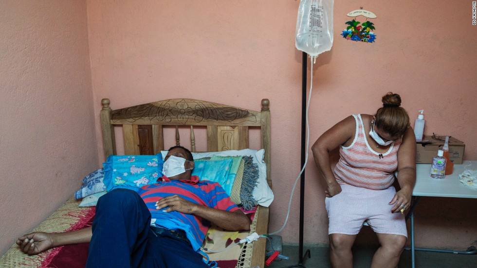 A man who worked in the sugar cane fields for decades receives dialysis at home with his daughter. He and his 24-year-old son, who worked in the fields for just five years, are both suffering from kidney disease. The names of the victims and their families are being withheld due to the ongoing tension about the prevalence of the disease.
