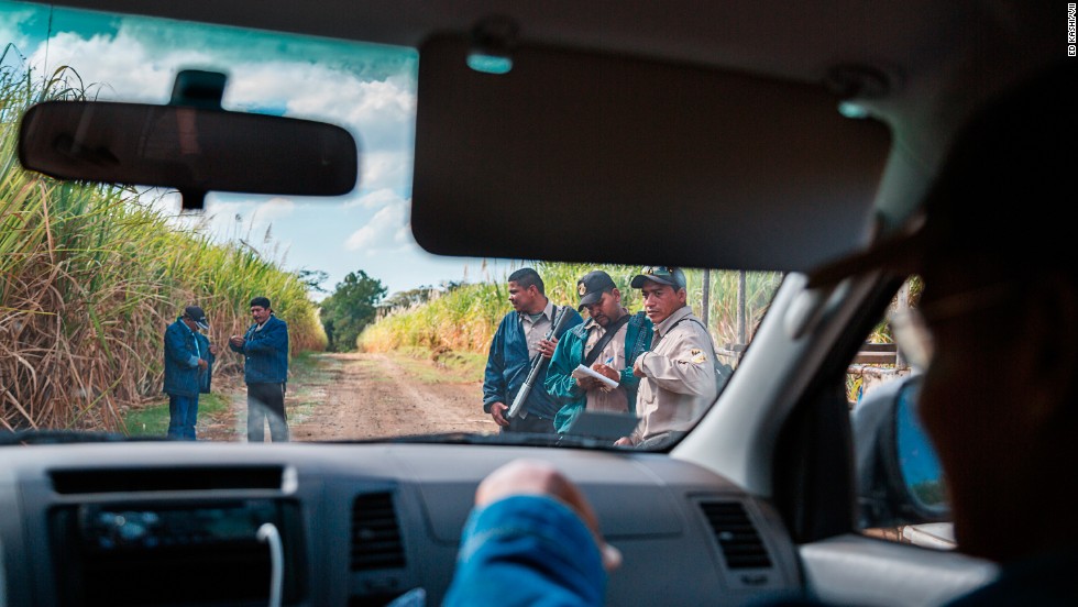 Security guards confront local workers and a member of La Isla Foundation for trespassing in the fields. La Isla is a nongovernmental organization addressing the increased incidence of kidney disease in the area.