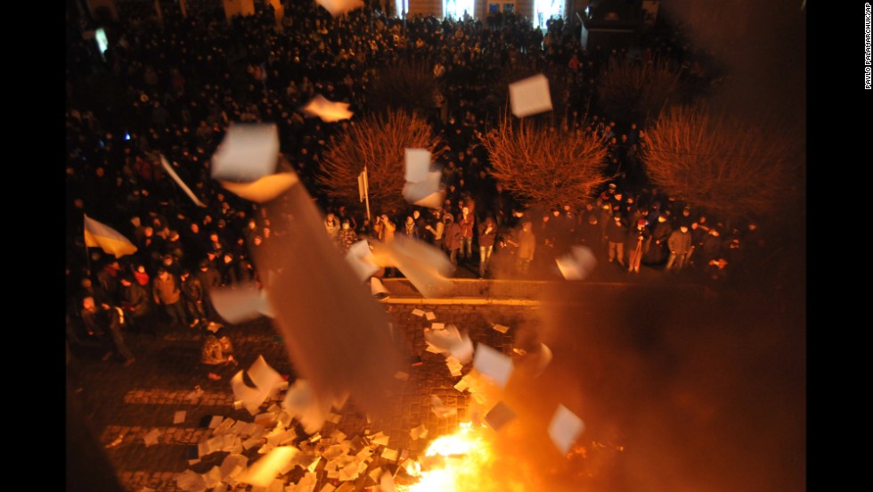 Protesters in Lviv burn papers from a government building on February 19.