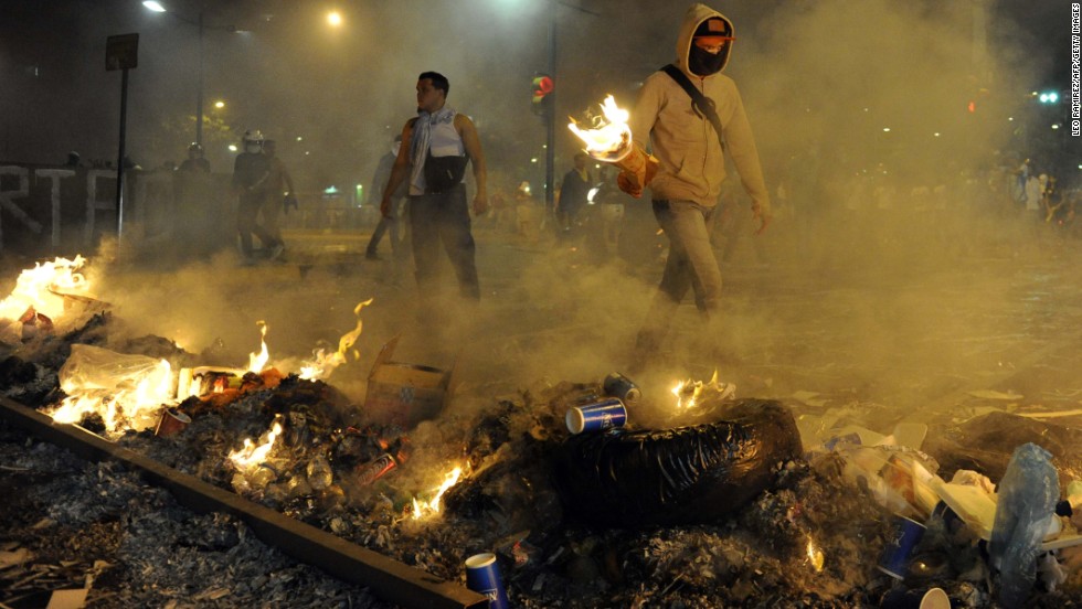 Protesters light fires during an anti-government demonstration in Caracas on Wednesday, February 19.