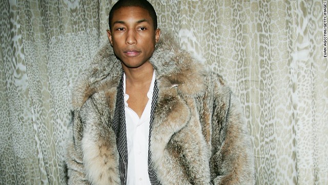NEW YORK - DECEMBER 6:  Singer Pharrell Williams attends a preview gala dinner for the Metropolitan Museum&#39;s &quot;Wild: Fashion Untamed&quot; exhibition, hosted by fashion designer Robert Cavalli, on December 6, 2004 at the Metropolitan Museum of Art, in New York City. (Photo by Evan Agostini/Getty Images)