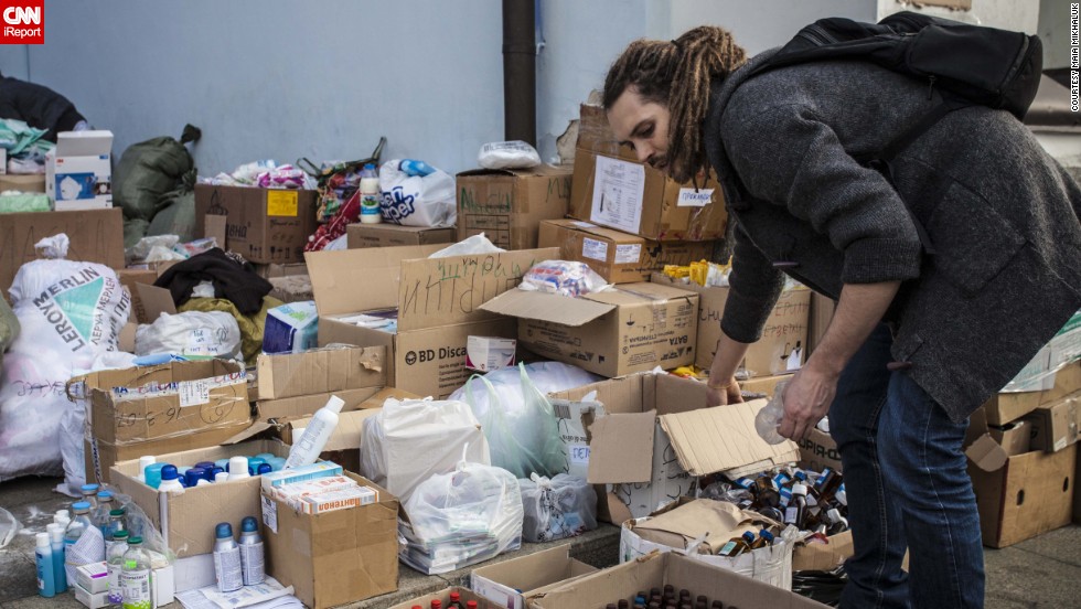 Volunteers sort though supplies a the  the Mykhailovsky Cathedral in Kiev. The cathedral opened its doors for protesters wounded during the clashes with riot police Wednesday and Thursday.