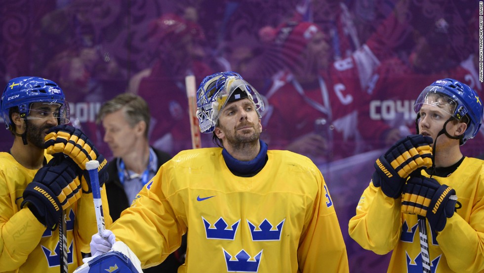 Henrik Lundqvist, center, and his teammates on the Swedish hockey team received silver medals on February 23.