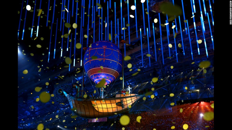 A balloon floats through falling confetti during the ceremony. 