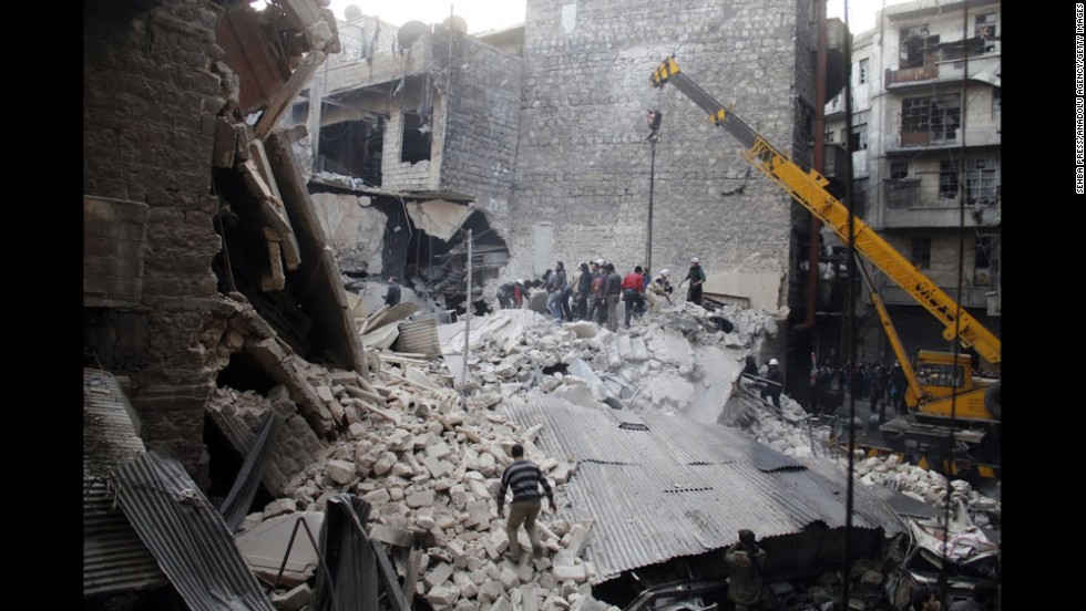 People dig through the rubble of a building in Damascus that was allegedly hit by government airstrikes on Thursday, February 27. 