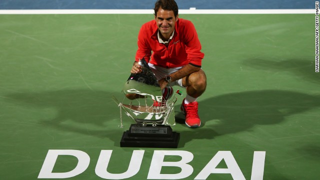 Roger Federer poses for photographers after clinching a sixth Dubai title on Saturday. 