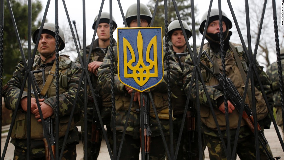 Ukrainian soldiers guard a gate of an infantry base in Perevalne on March 2.