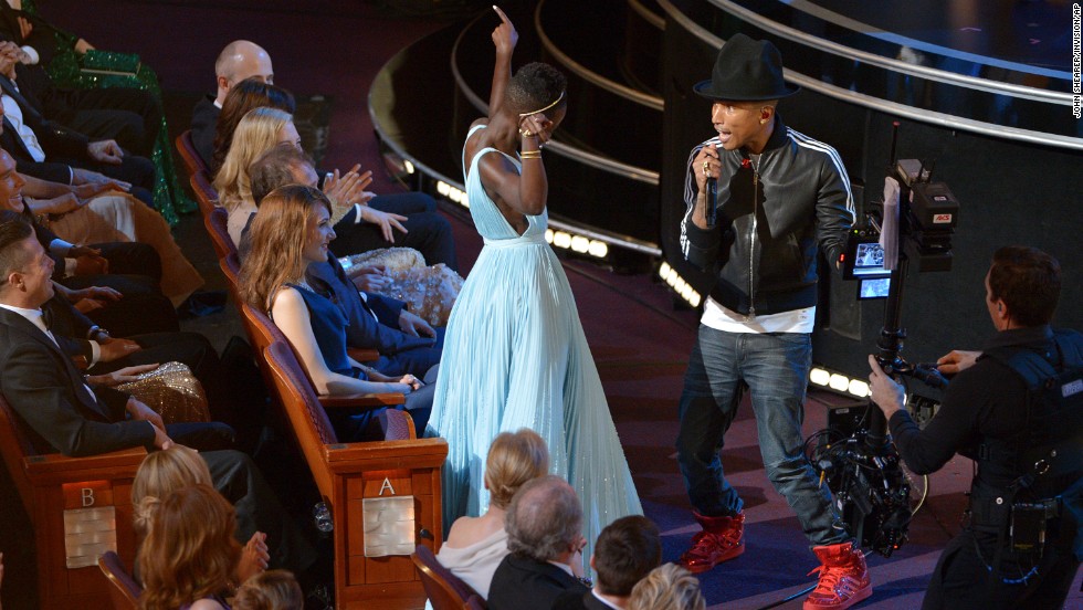 Nyong&#39;o dances with Pharrell Williams during his performance of &quot;Happy.&quot;