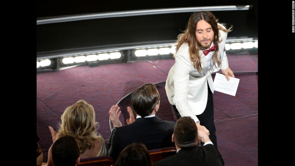 Jared Leto shakes hands with an audience member after winning the best supporting actor Oscar for his role in &quot;Dallas Buyers Club.&quot;