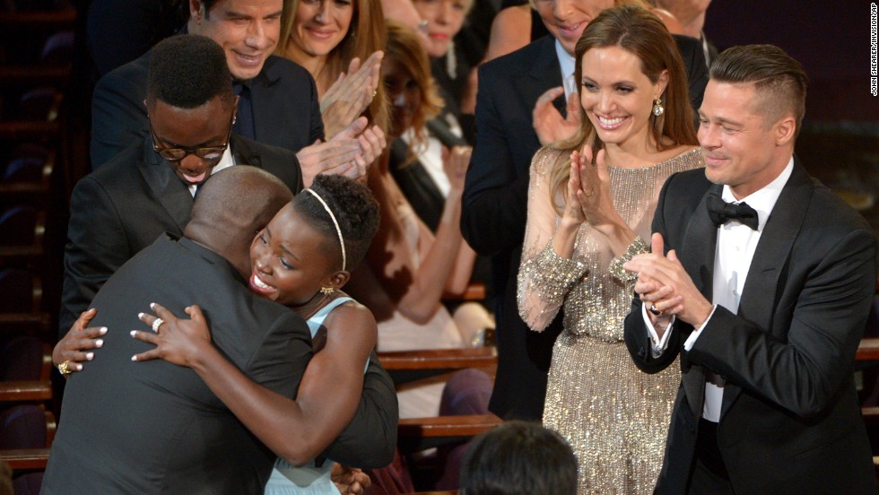 Lupita Nyong&#39;o hugs McQueen after winning best supporting actress for her role in &quot;12 Years a Slave.&quot;