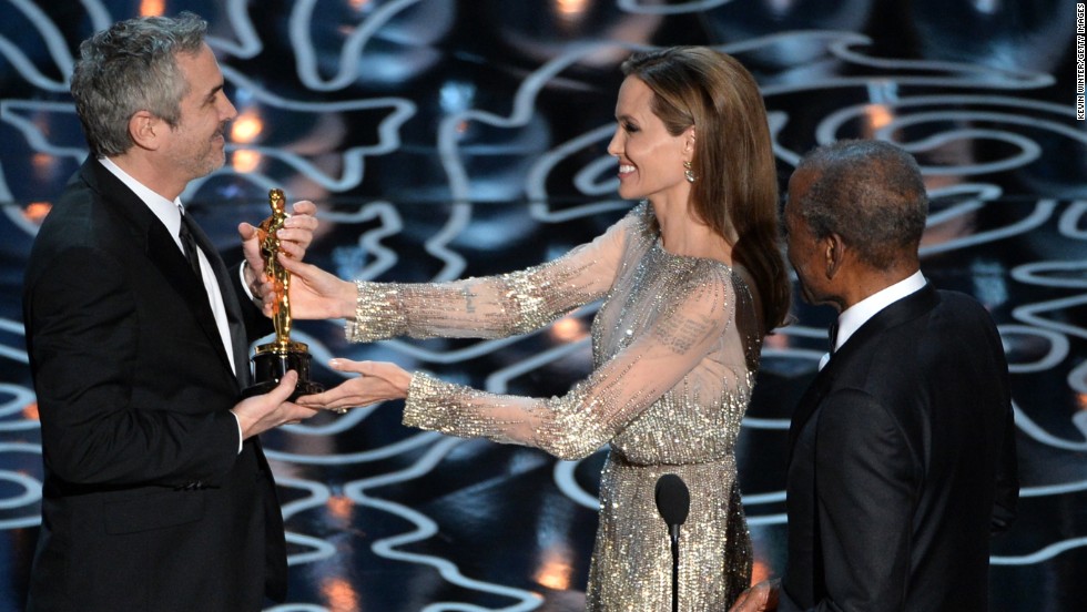 Angelina Jolie and Sidney Poitier present Alfonso Cuaron with the best director Oscar for &quot;Gravity.&quot;