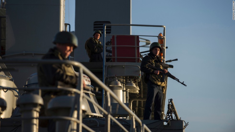 Ukrainian seamen stand guard on the Ukrainian navy ship Slavutych in the Sevastopol harbor on Monday, March 3.