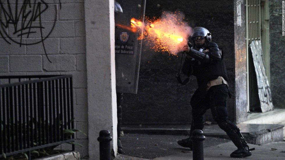 A National Guard member shoots tear gas during protests in Caracas on March 3.