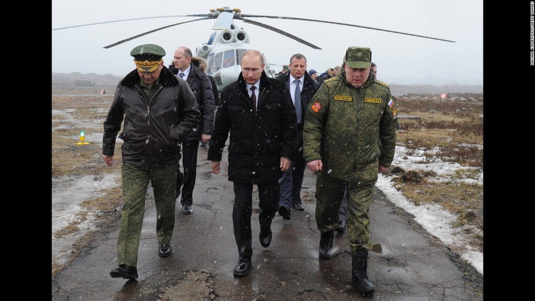 Putin arrives to watch a military exercise in Russia&#39;s Leningrad region in March 2014.