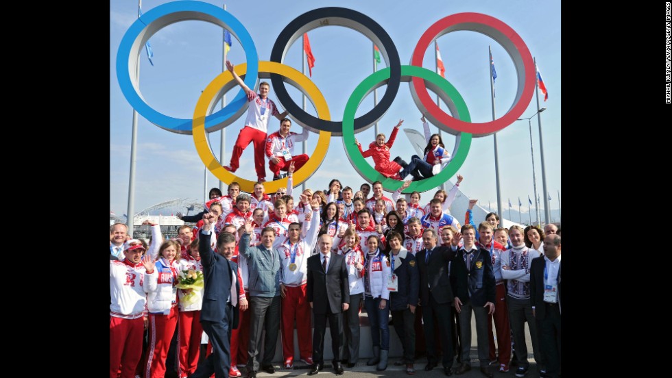 Putin poses for a photo with Russian Olympic athletes in Sochi, Russia, in February 2014. Russia hosted the Winter Olympic Games and won the most medals.
