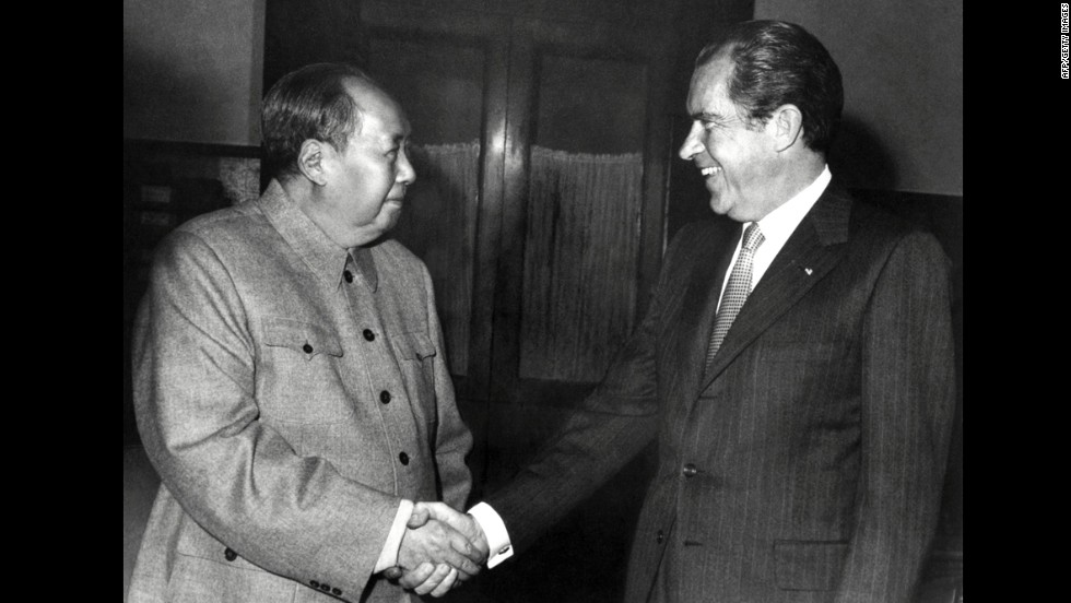 Chinese leader Mao Zedong shakes hands with U.S. President Richard Nixon after their meeting in Beijing on February 22, 1972. Nixon became the first U.S. president to visit China. The two countries issued a communiqué recognizing their &quot;essential differences&quot; while making it clear that &quot;normalization of relations&quot; was in all nations&#39; best interests. The rapprochement changed the balance of power with the Soviets. Two-and-a-half years later, Nixon resigned as president amid the Watergate scandal.