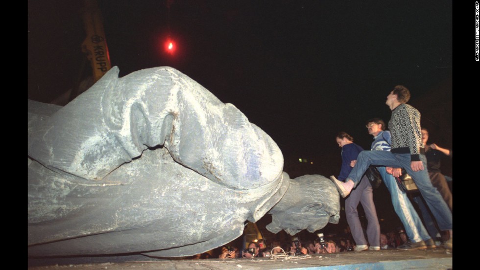 Jubilant people step on the head of the statue of Felix Dzerzhinsky, the founder and chief of the Soviet secret police, later known as KGB, which was toppled in front of the KGB headquarters in Moscow, on August 23, 1991. The KGB was responsible for mass arrests and executions. 