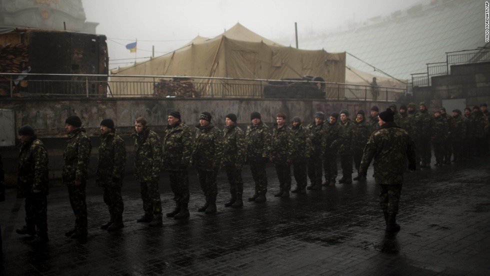 Ukrainian military recruits line up to receive instructions in Kiev&#39;s Independence Square on Tuesday, March 4. 