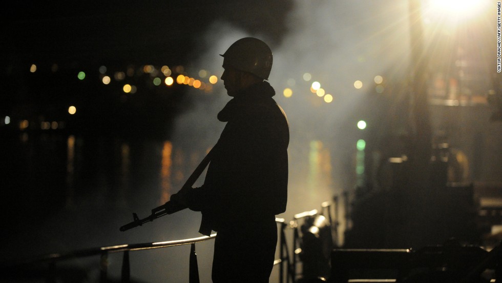 A sailor guards the Ukrainian Navy ship Slavutych in the Bay of Sevastopol on Wednesday, March 5.