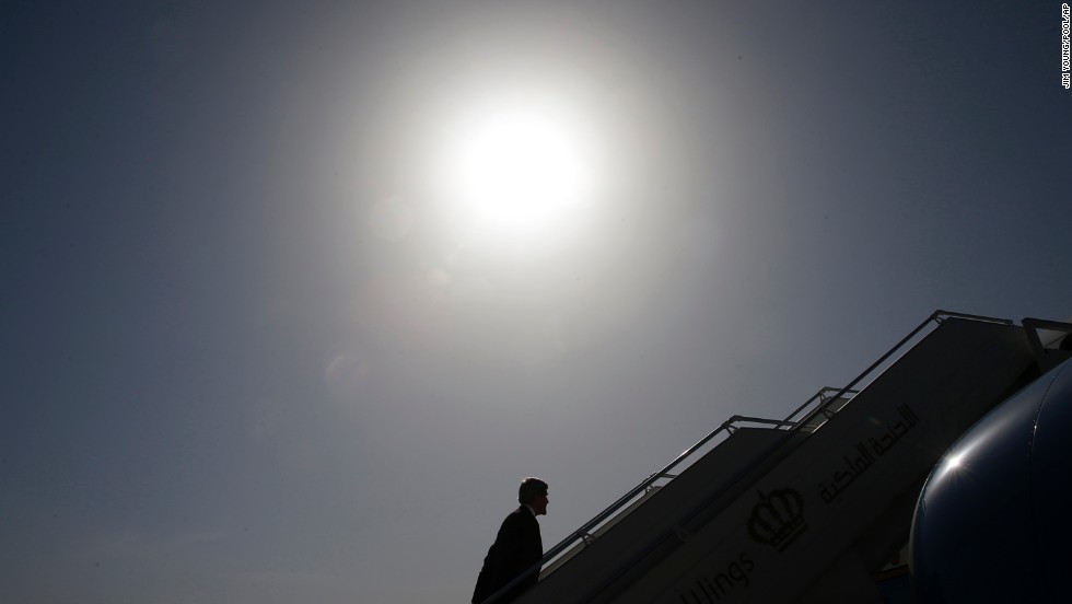 Kerry boards a plane in Amman, Jordan, where in May 2013 he met with leaders to discuss the ongoing conflict in Syria.
