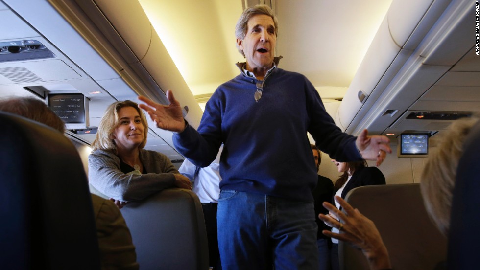 Kerry talks to reporters en route to London on his first trip as secretary of state in February 2013. The trip took him through European and Middle Eastern capitals. 