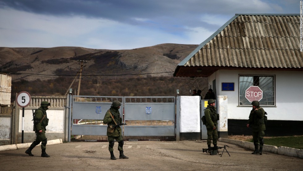 Servicemen guard a checkpoint at a Ukrainian navy base in Perevalne on March 6.
