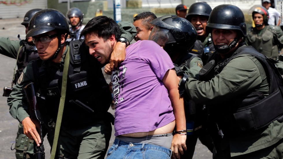 National Guard members arrest an anti-government protester during clashes in the Los Ruices neighborhood of Caracas on Thursday, March 6.
