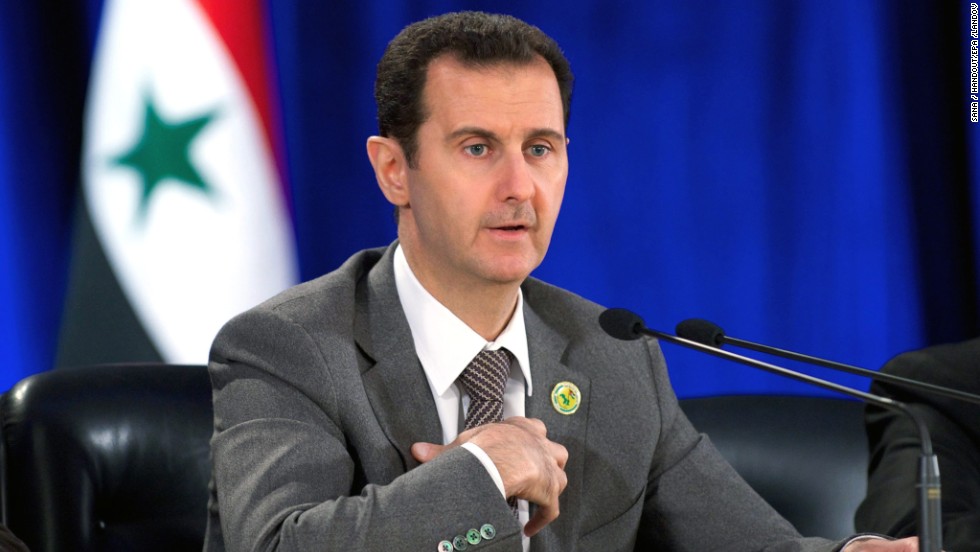 A handout photo released by SANA shows Syrian President Bashar al-Assad speaking March 8 during a meeting in Damascus to mark the 51st anniversary of the 1963 revolution, when Baath Party supporters in the Syrian army seized power. Al-Assad said the country will go on with reconciliation efforts along with its fight against terrorism.