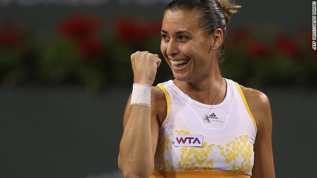 Italian tennis player Flavia Pennetta celebrates her victory over China&#39;s world No. 2 Li Na at Indian Wells Tennis Garden.