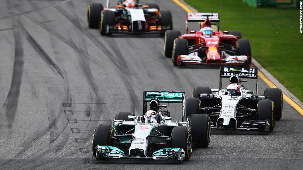 Cars bunch up behind Lewis Hamilton who quickly slipped back through the field from pole and retired after three laps with an engine power fault.