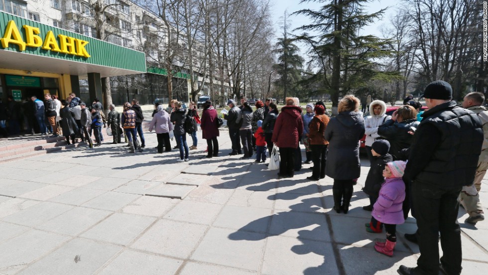 People stand in line to vote at a bank office in Simferopol, Ukraine. Results are expected on Monday. The United States has already said it expects the Black Sea peninsula&#39;s majority ethnic Russian population to vote in favor of joining Russia.